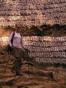 Day 14 : Namche Bazaar to Lukla.\r\nAshe descending past a huge mani stone.